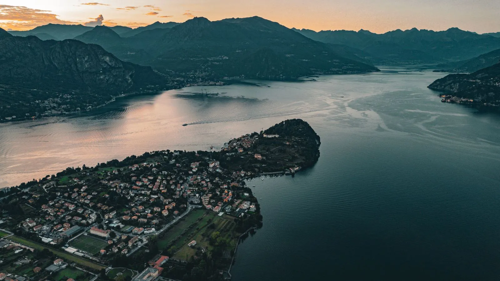 Aerial view of Bellagio village on Lake Como at sunset, a highlight stop on the private Lake Como day tour from Milan